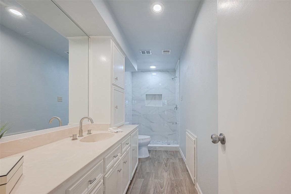 15600 Barkers Landing Road, Unit 20 Houston, TX 77079 - Photo 41 of 49 Recently updated bathroom with stylish porcelain tile. The deluxe vinyl flooring extends to the wet area too.