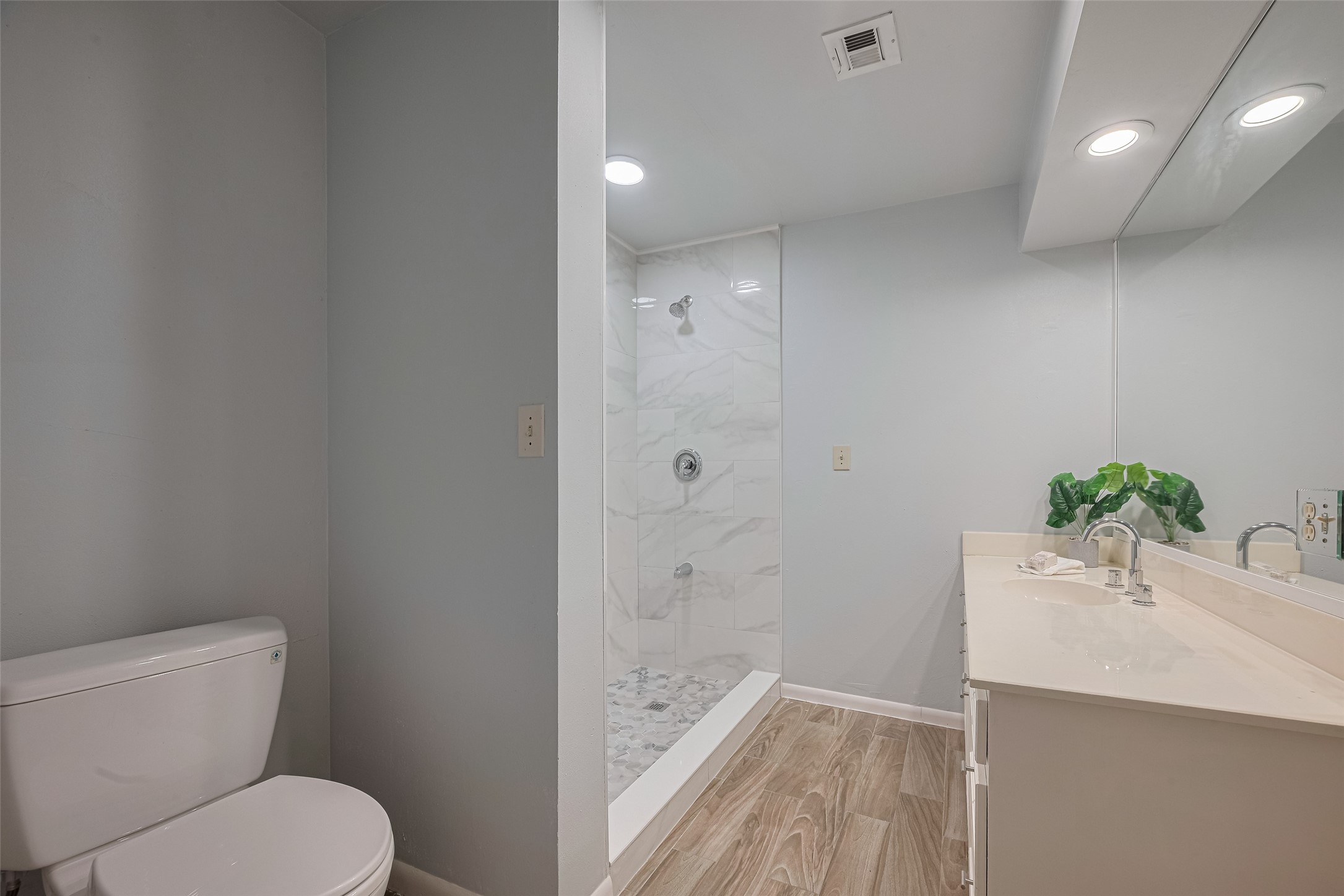 15600 Barkers Landing Road, Unit 20 Houston, TX 77079 - Photo 45 of 49 This is the 3rd ensuite bathroom that has direct access to the bedroom and to the hallway as well. It is recently updated with trendy porcelain tile complimenting the neutral wall paint.