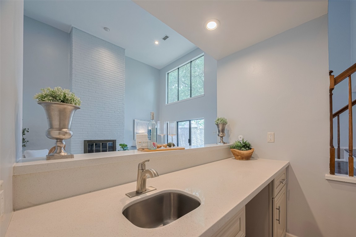 15600 Barkers Landing Road, Unit 20 Houston, TX 77079 - Photo 8 of 49 Quartz countertop and SS utility sink. Space for a beverage or wine fridge.