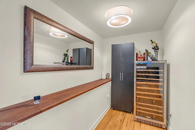 a view of a living room with wooden floor