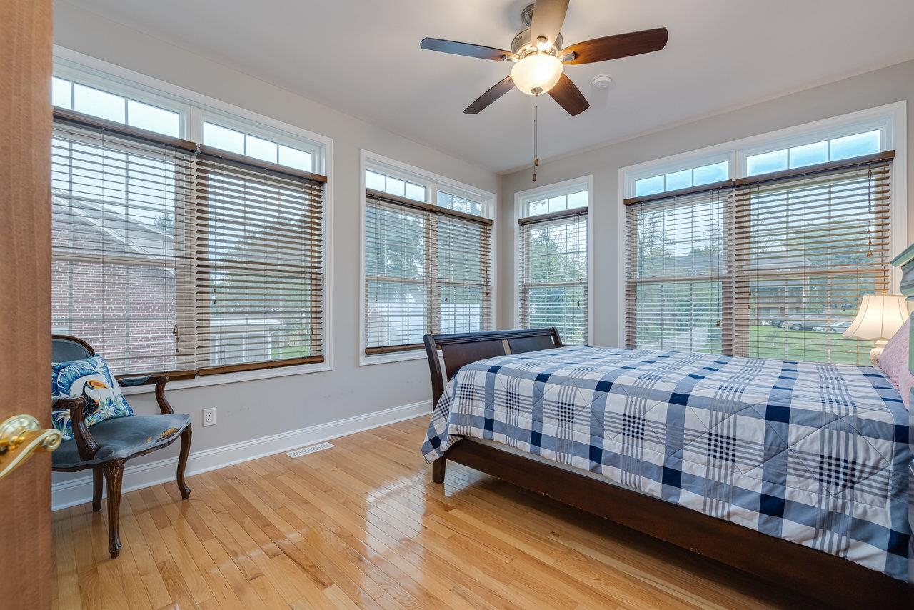 155 Main Street Dayton, VA 22821 - Photo 34 of 75 a bed sitting in a spacious bedroom next to a window