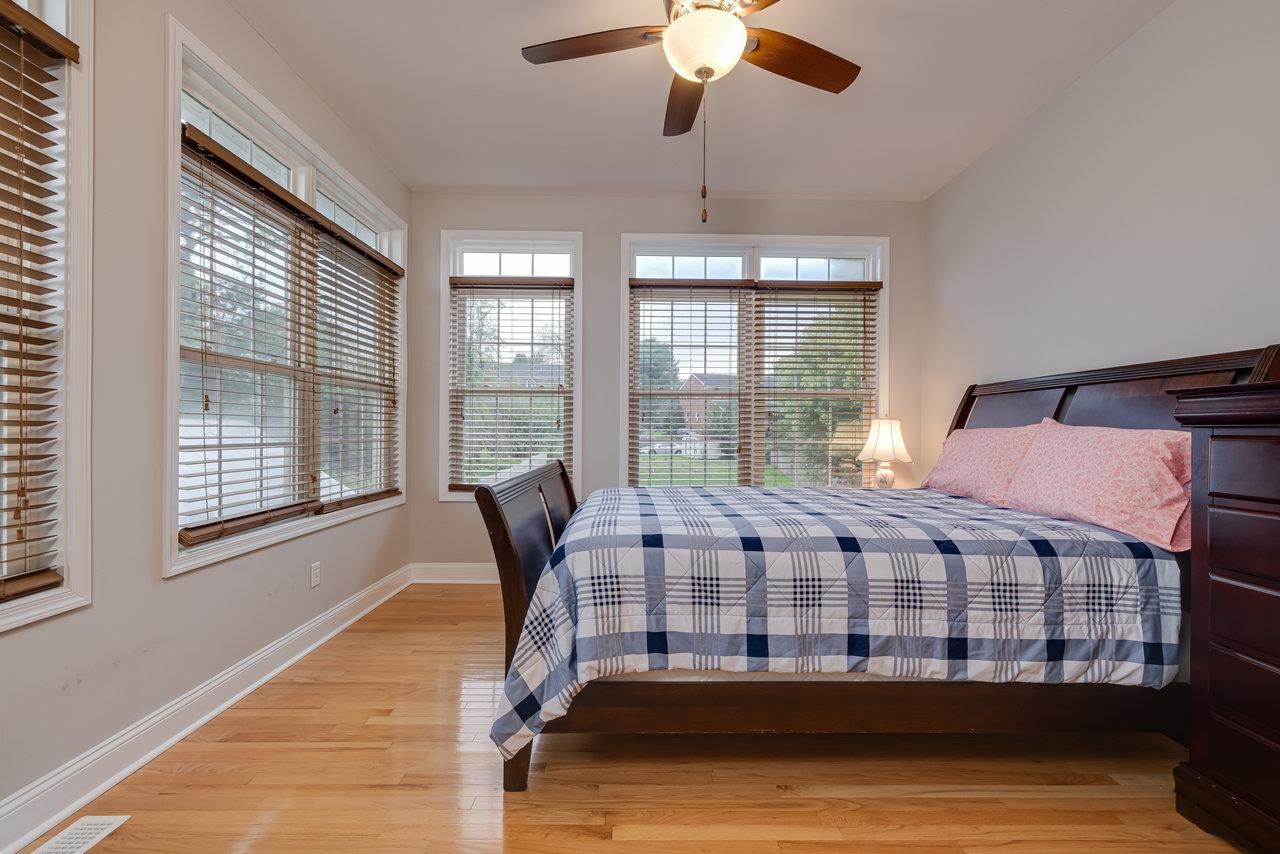 155 Main Street Dayton, VA 22821 - Photo 35 of 75 a bedroom with a bed and wooden floor