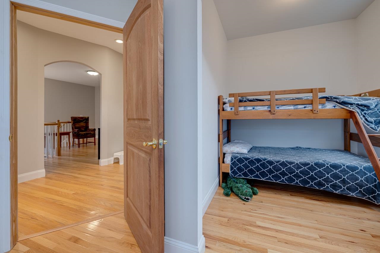 155 Main Street Dayton, VA 22821 - Photo 37 of 75 a bedroom with a bed and a view of en suite bathroom