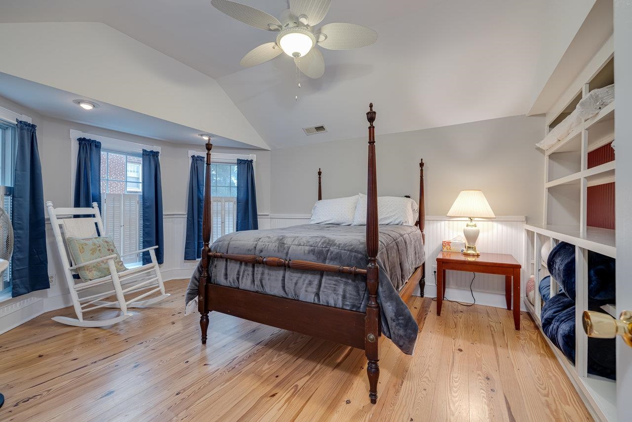 155 Main Street Dayton, VA 22821 - Photo 61 of 75 a bedroom with a bed and a chandelier