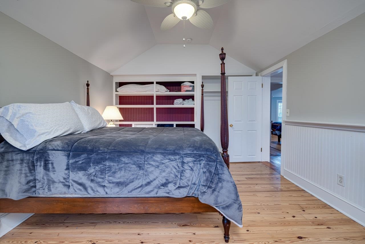 155 Main Street Dayton, VA 22821 - Photo 62 of 75 a living room with a bed furniture and a wooden floor