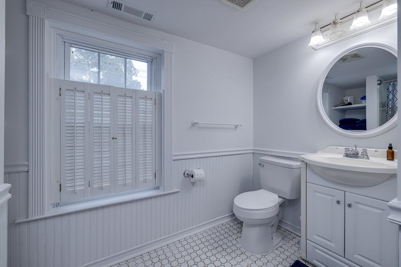 155 Main Street Dayton, VA 22821 - Photo 66 of 75 a bathroom with a toilet a sink and mirror