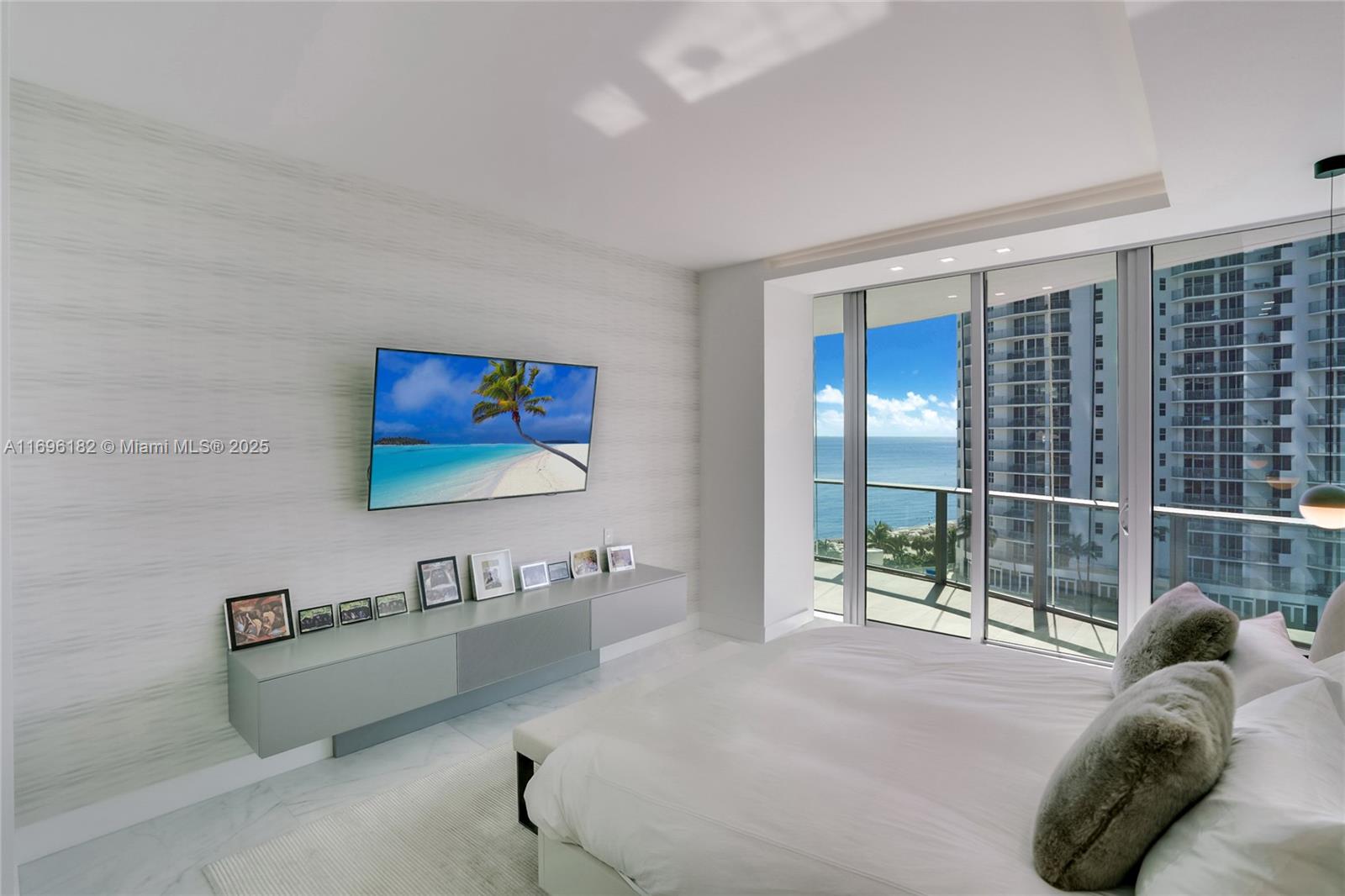 17475 Collins Avenue, Unit 602 Sunny Isles Beach, FL 33160 - Photo 9 of 24 a living room with furniture