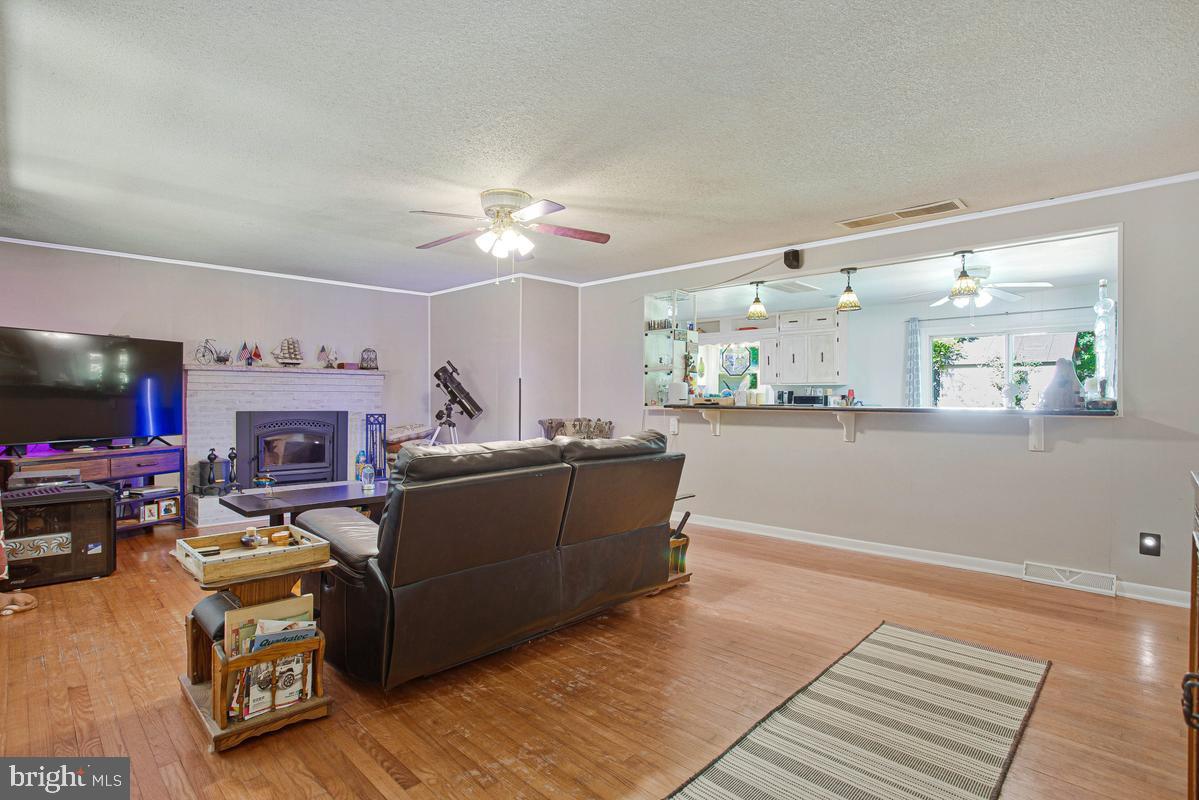 6600 Ashland Road La Plata, MD 20646 - Photo 12 of 40 a living room with furniture and a fireplace