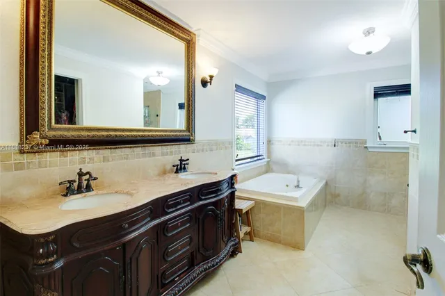 a bathroom with a sink double vanity and a mirror