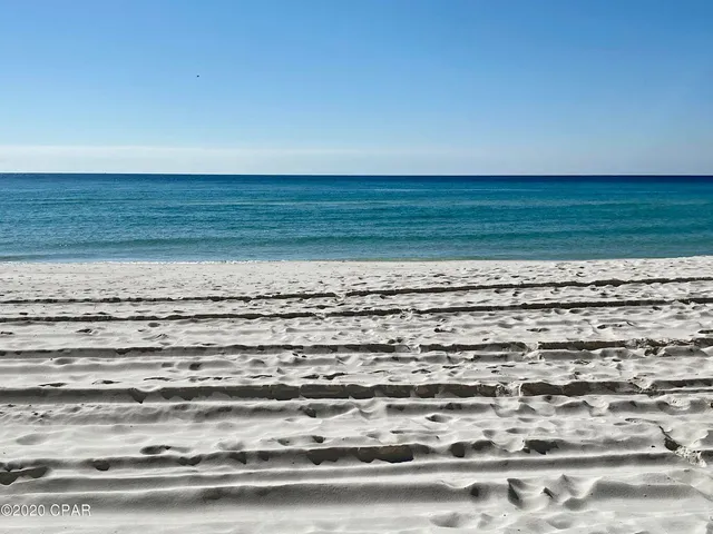 a bathroom with a bathtub and a walk in closet