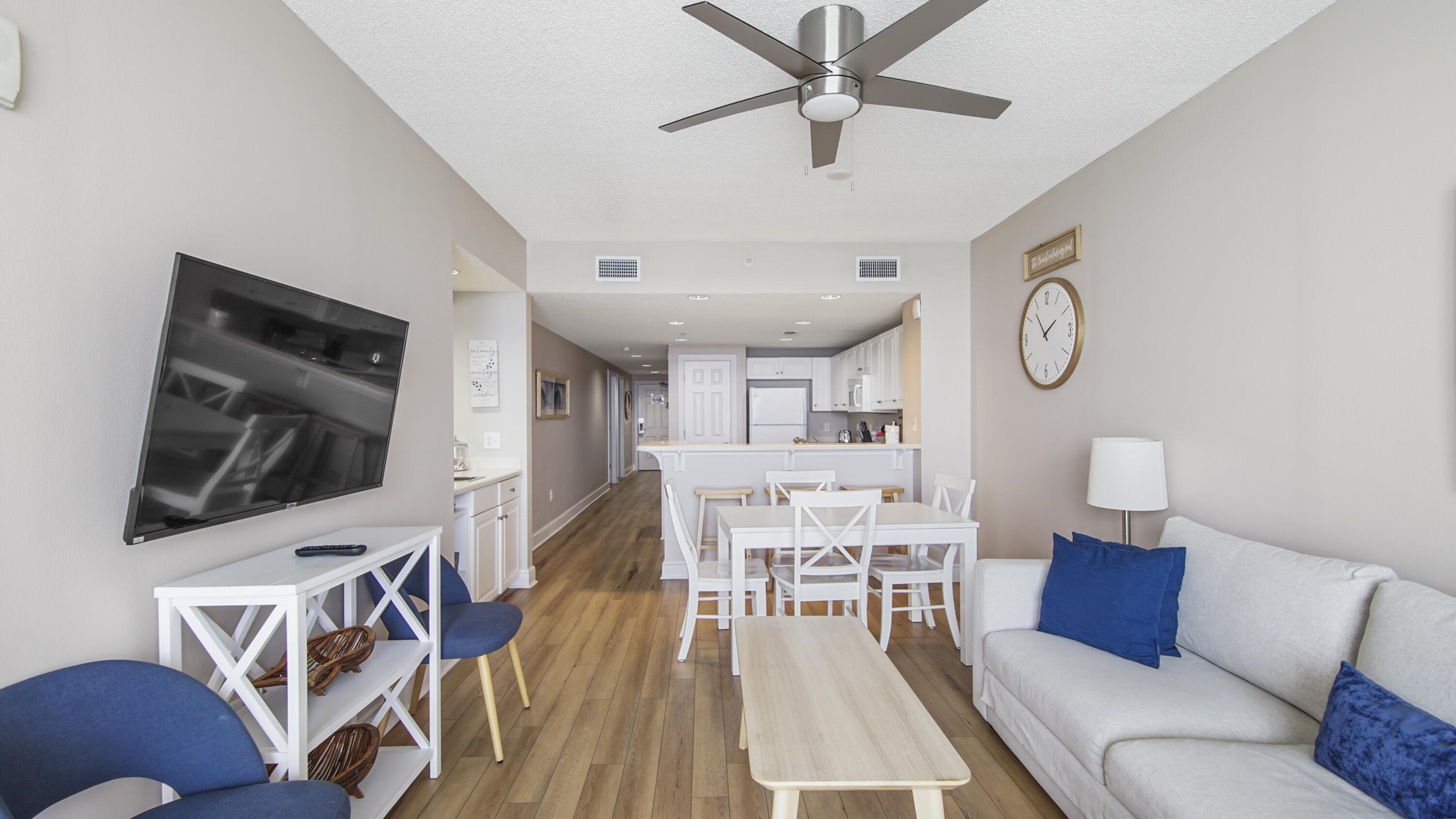 10811 Front Beach Road, Unit 1405 Panama City Beach, FL 32408 - Photo 12 of 76 a living room with furniture and a flat screen tv