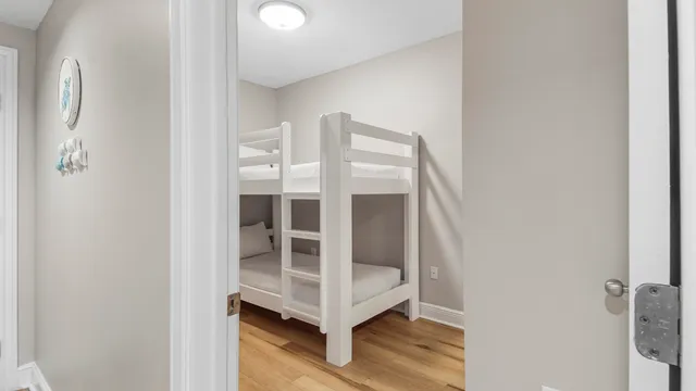 a bathroom with a sink toilet double vanity and shower