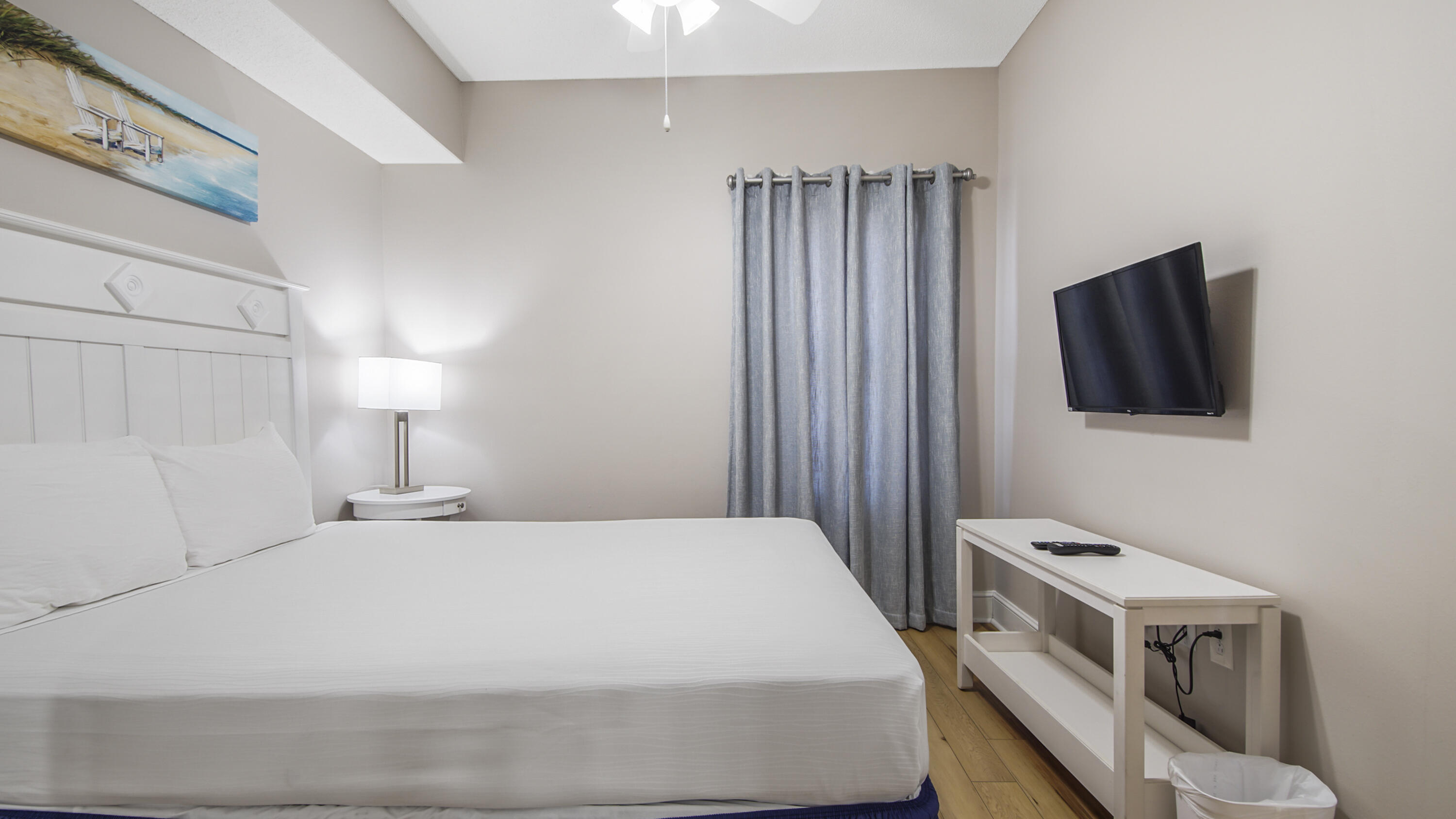 10811 Front Beach Road, Unit 1405 Panama City Beach, FL 32408 - Photo 18 of 76 a bedroom with a bed and a flat screen tv