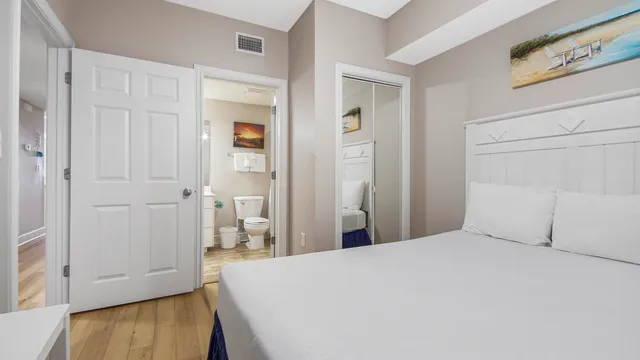 a kitchen with stainless steel appliances granite countertop a sink refrigerator and cabinets