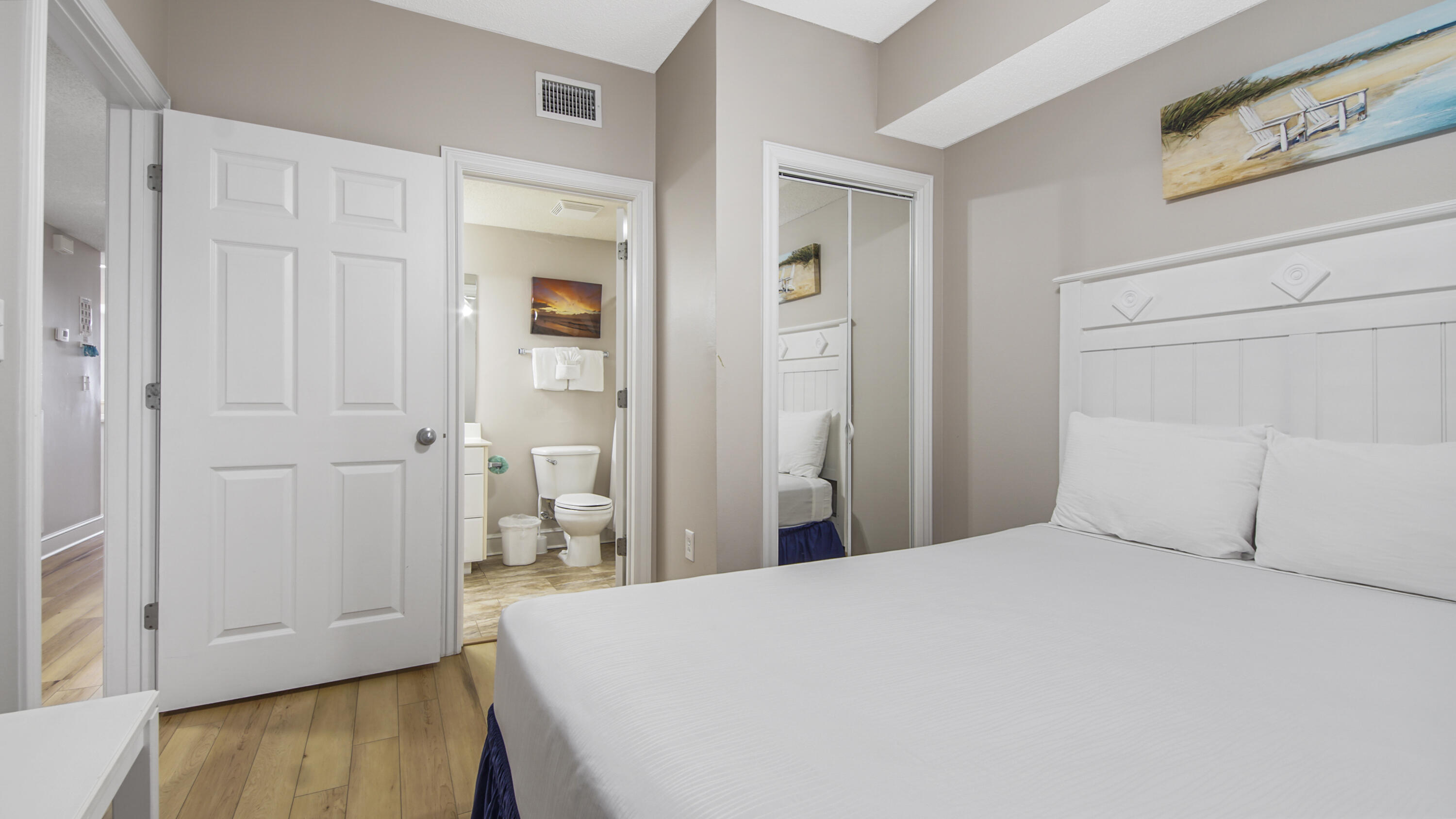 10811 Front Beach Road, Unit 1405 Panama City Beach, FL 32408 - Photo 19 of 76 a bedroom with a bed and hallway