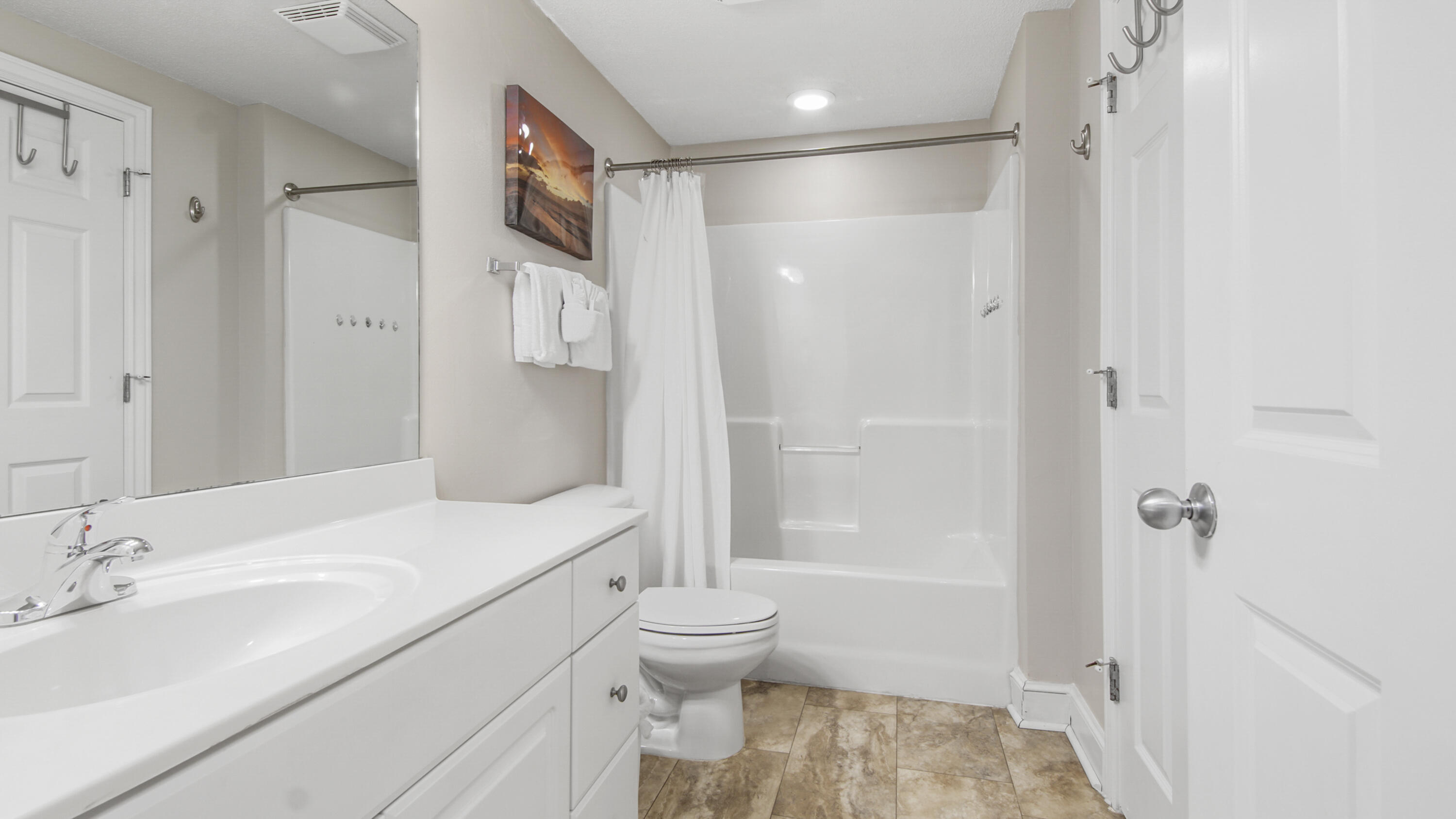 10811 Front Beach Road, Unit 1405 Panama City Beach, FL 32408 - Photo 20 of 76 a bathroom with a sink toilet double vanity and shower