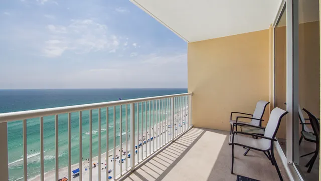 a view of a balcony with wooden floor