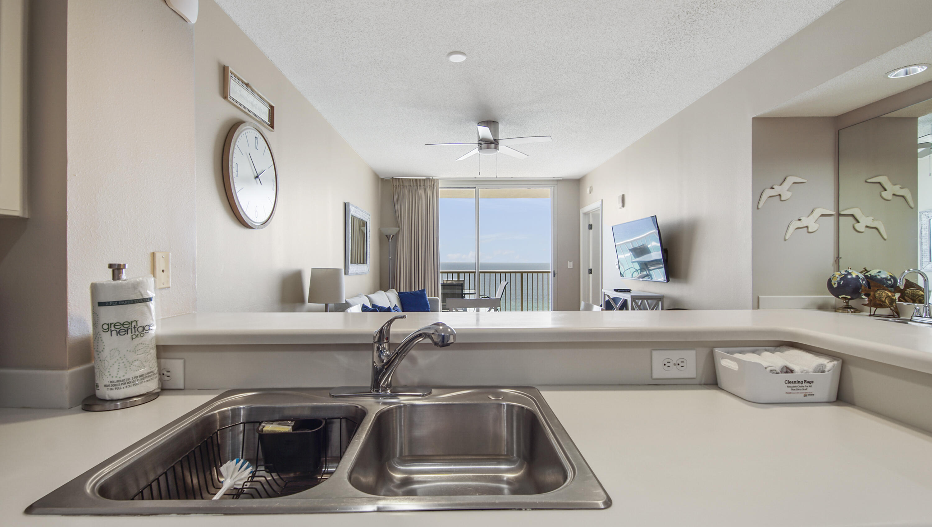 10811 Front Beach Road, Unit 1405 Panama City Beach, FL 32408 - Photo 24 of 76 a kitchen with a sink and a mirror