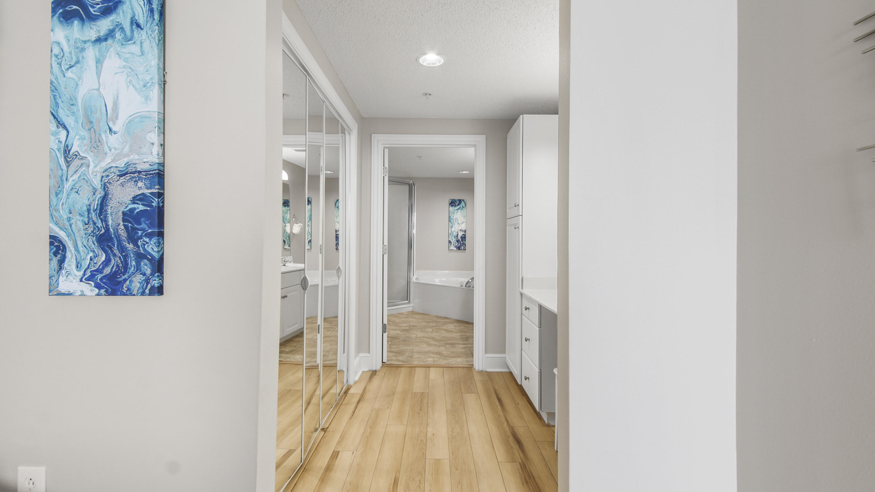 10811 Front Beach Road, Unit 1405 Panama City Beach, FL 32408 - Photo 28 of 76 a view of a hallway with wooden floor
