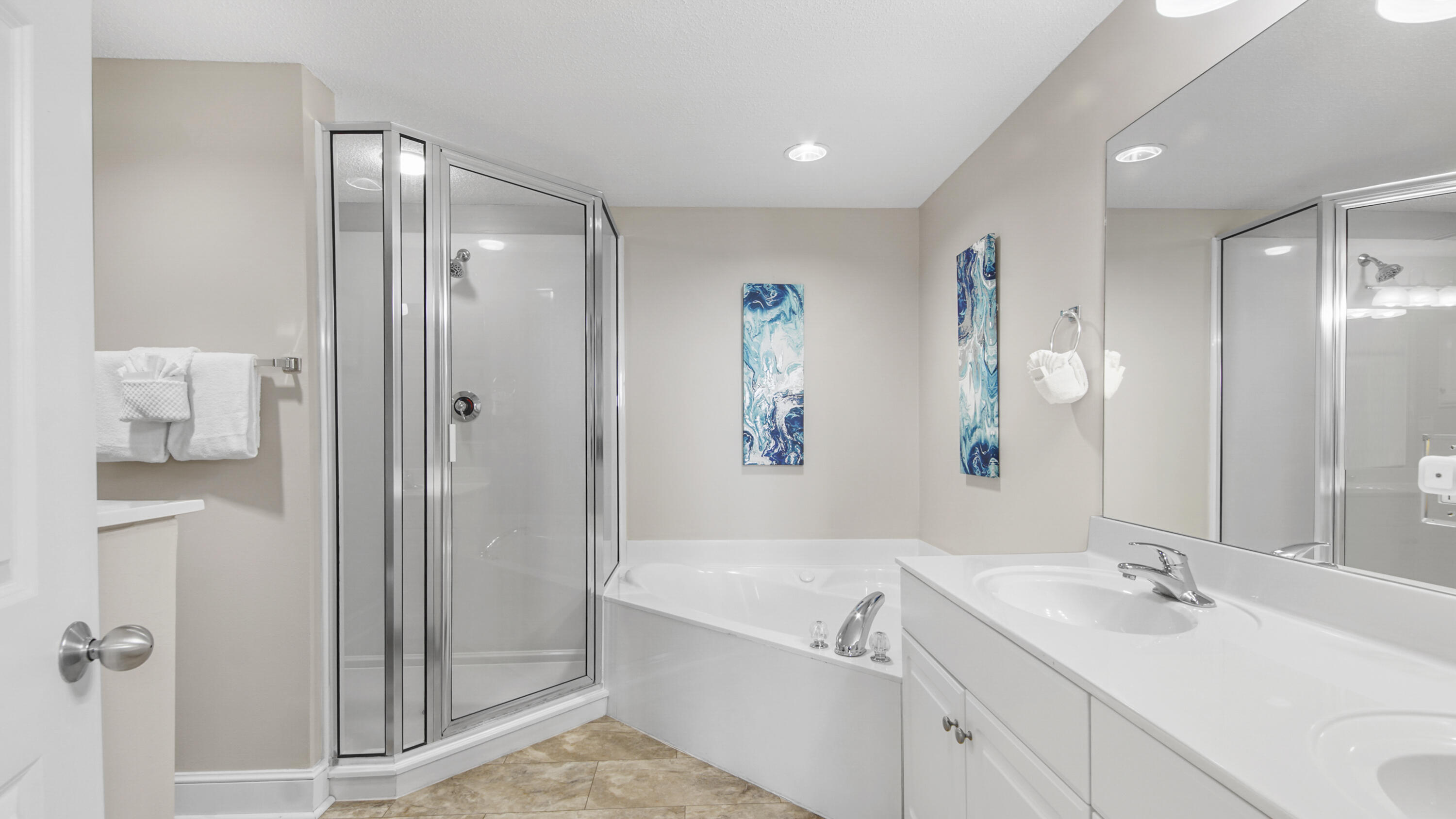 10811 Front Beach Road, Unit 1405 Panama City Beach, FL 32408 - Photo 30 of 76 a bathroom with a tub sink and mirror