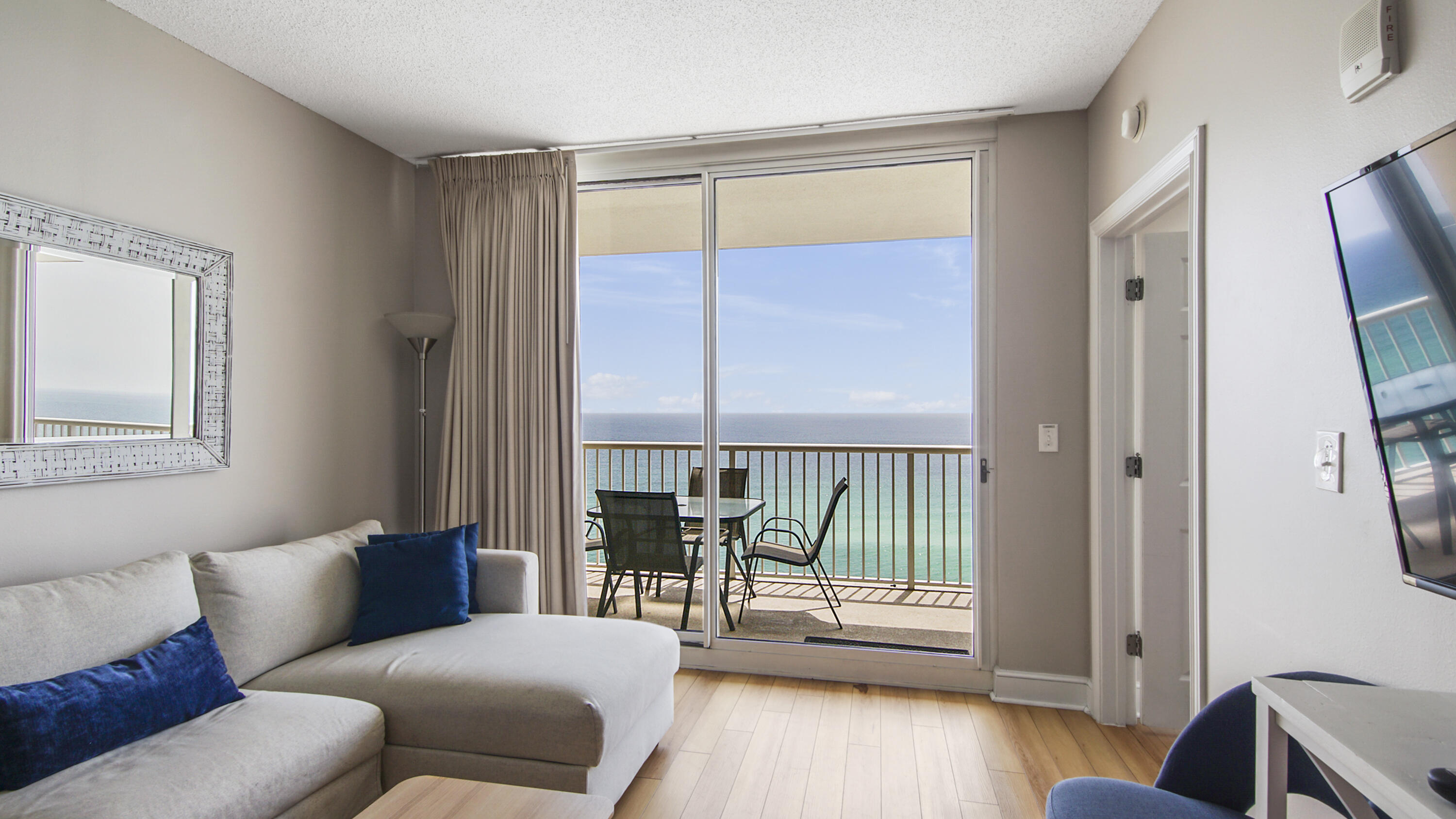 10811 Front Beach Road, Unit 1405 Panama City Beach, FL 32408 - Photo 8 of 76 a living room with furniture and a window