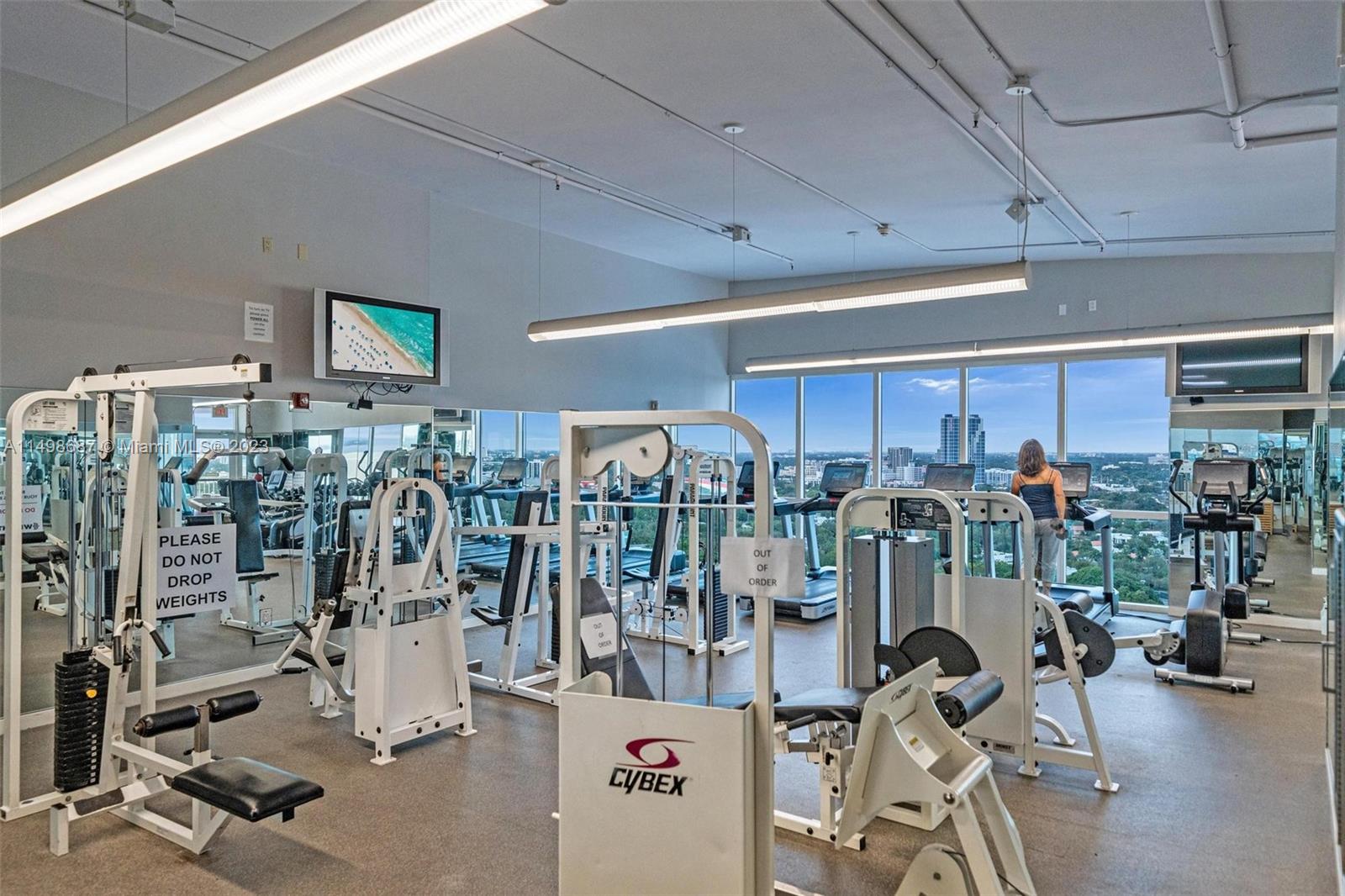 2889 McFarlane Road, Unit 1414 Miami, FL 33133 - Photo 15 of 15 a view of a room with gym equipment