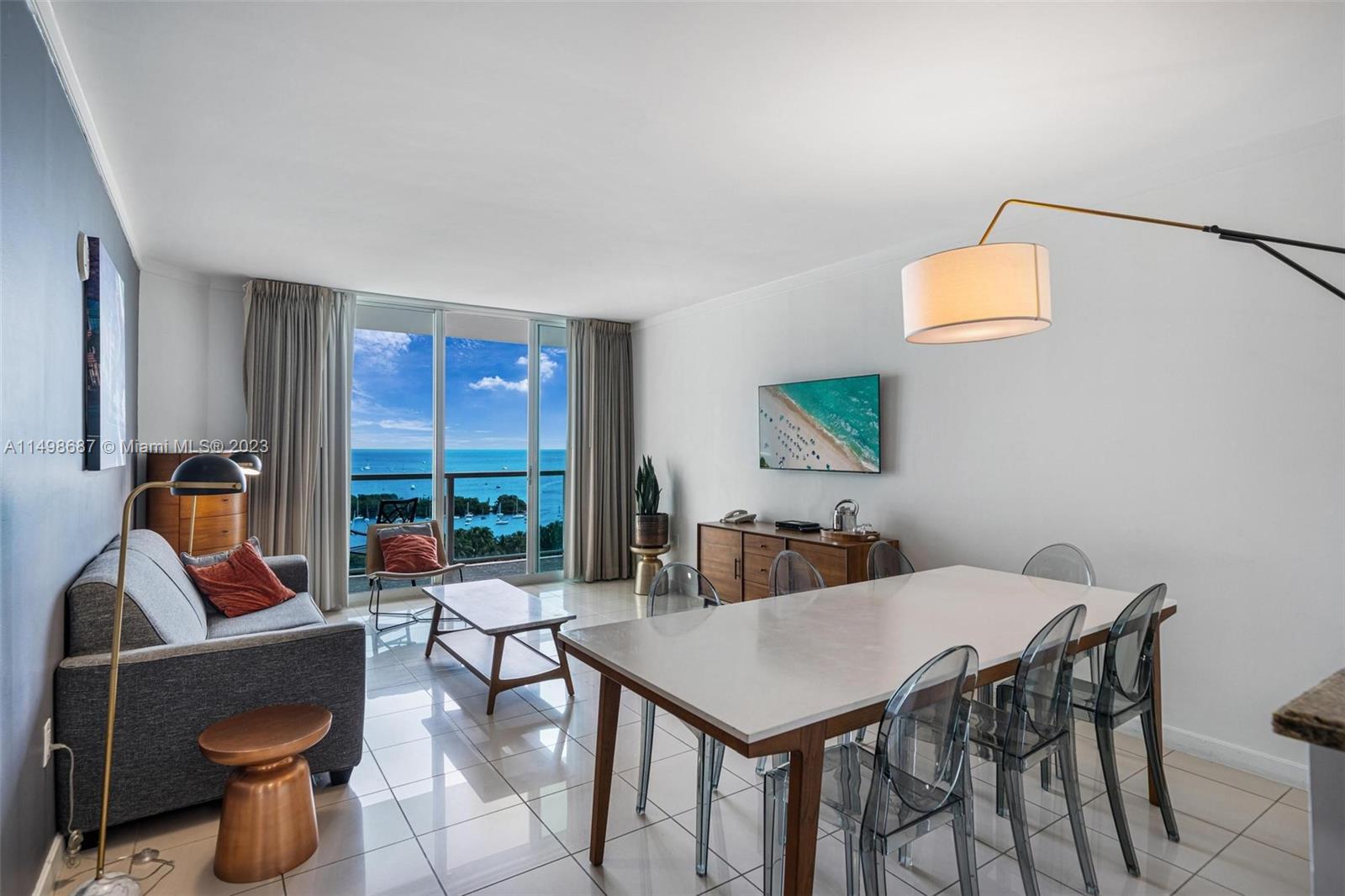 2889 McFarlane Road, Unit 1414 Miami, FL 33133 - Photo 3 of 15 a view of a dining room with furniture window and outside view