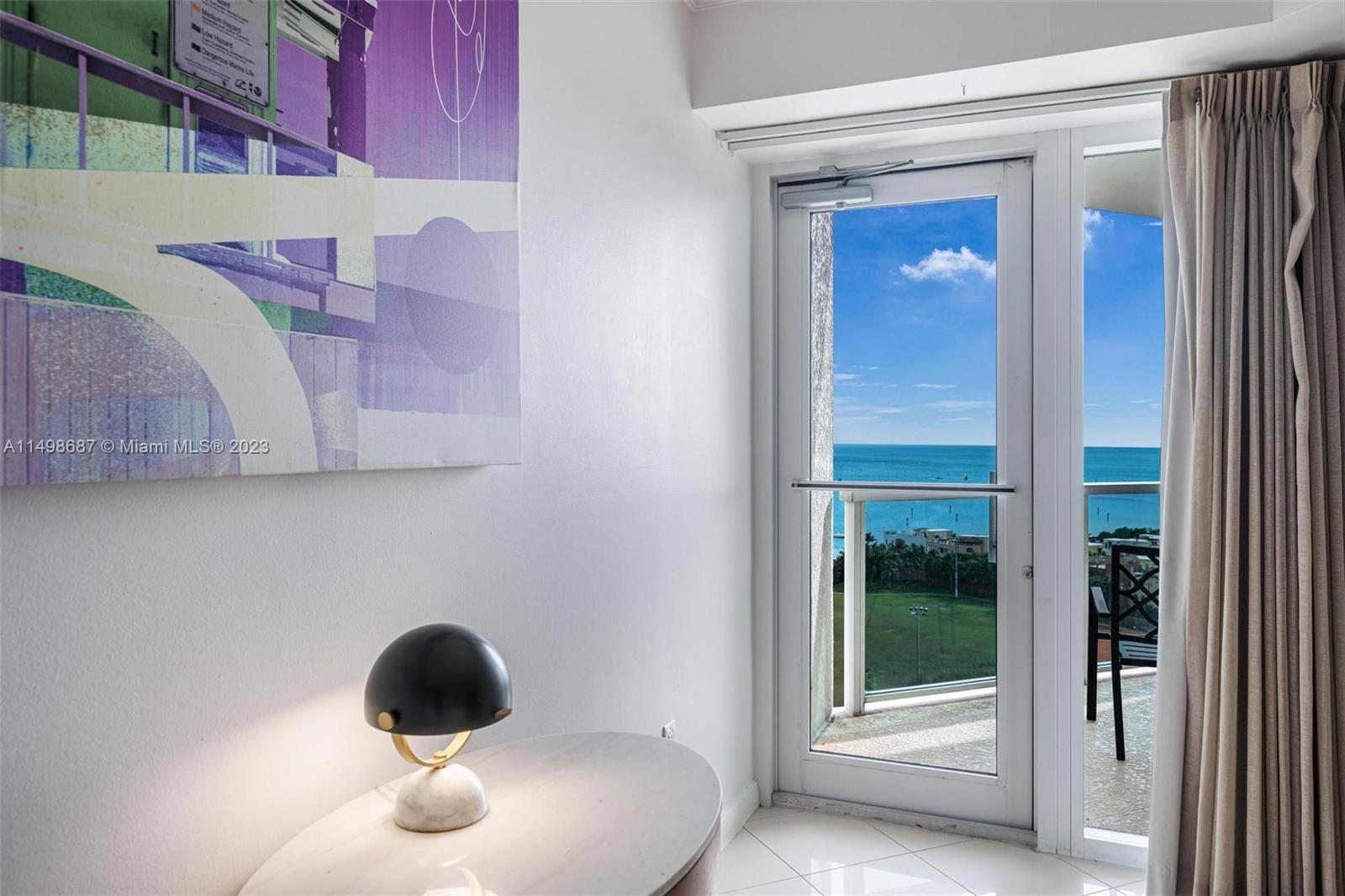 2889 McFarlane Road, Unit 1414 Miami, FL 33133 - Photo 9 of 15 a kitchen with a sink and a mirror