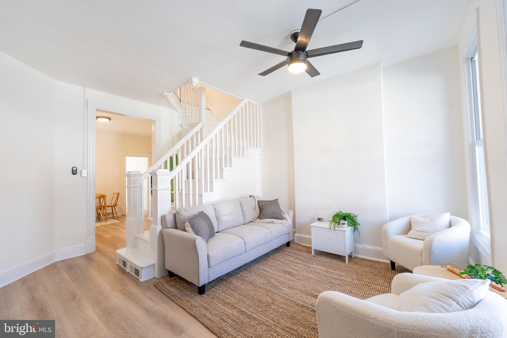 511 East 35th Street Baltimore, MD 21218 - Photo 3 of 19 a living room with furniture and a wooden floor