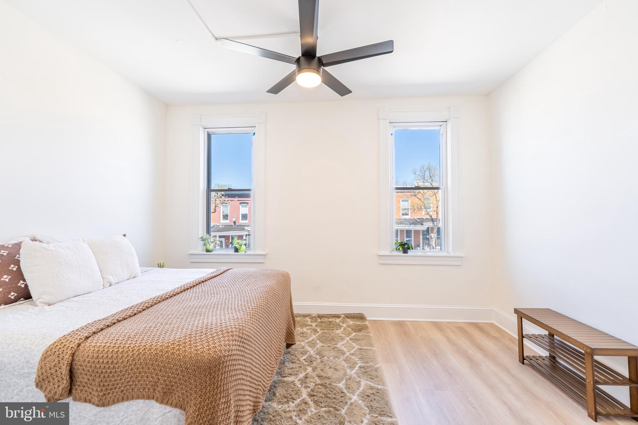 511 East 35th Street Baltimore, MD 21218 - Photo 9 of 19 a bedroom with a bed and a window
