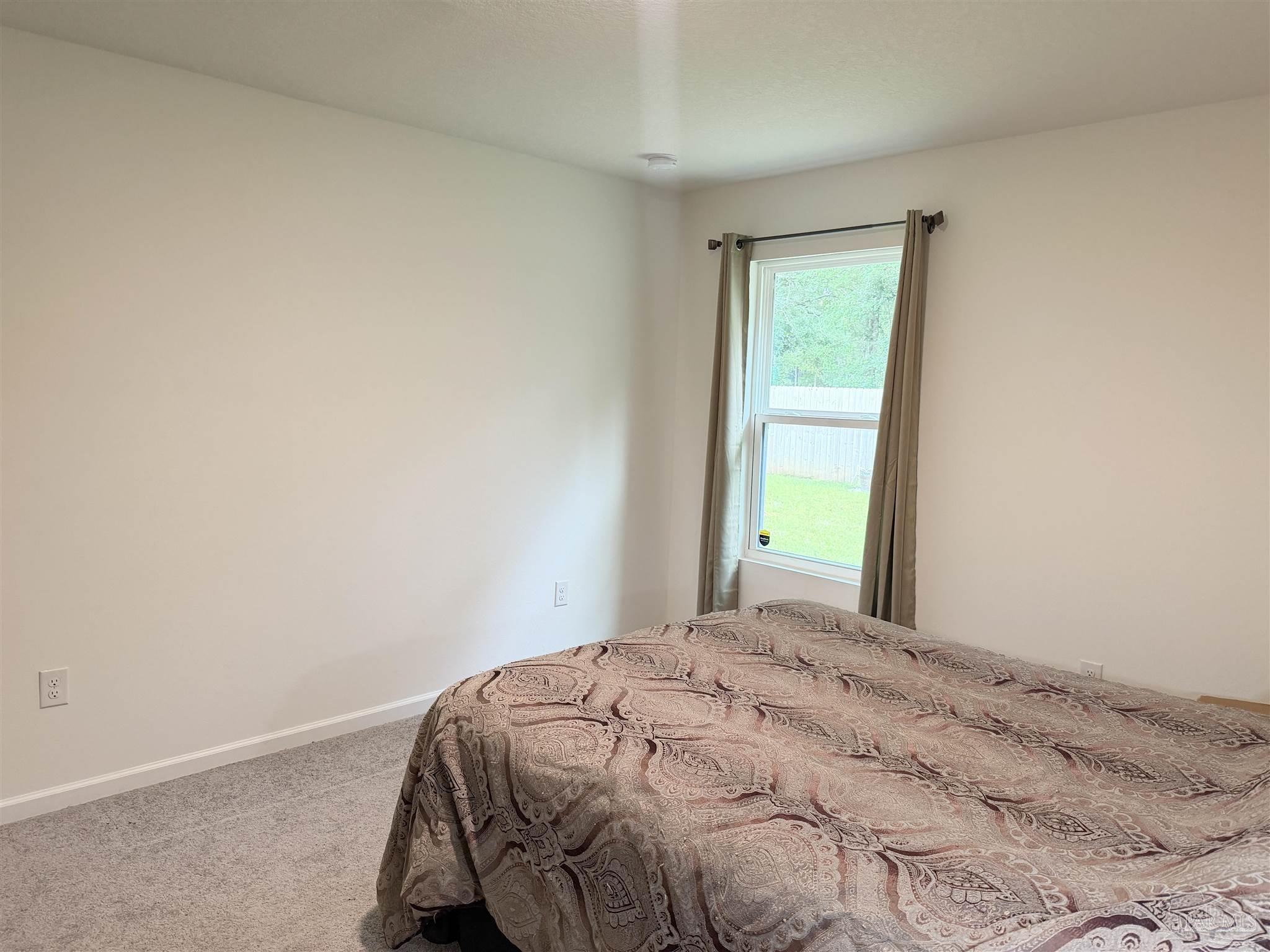 1625 Addies Way Pensacola, FL 32534 - Photo 41 of 50 a bedroom with a bed and a window