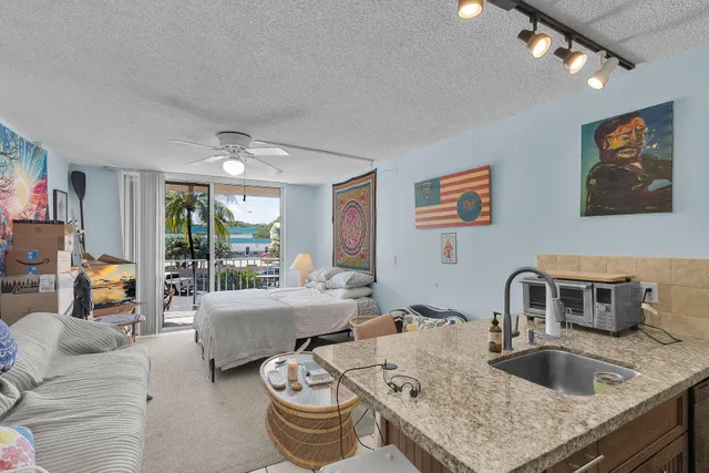 a living room with furniture and large window