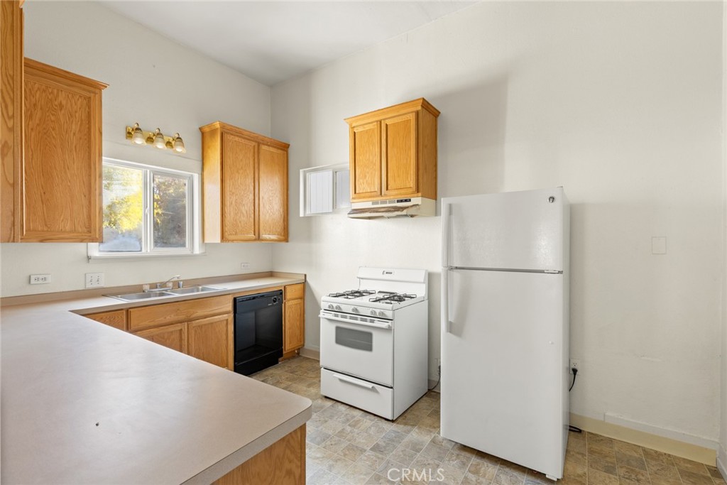 340 Oak Street Chico, CA 95928 - Photo 7 of 14 a kitchen with a refrigerator sink and stove top oven