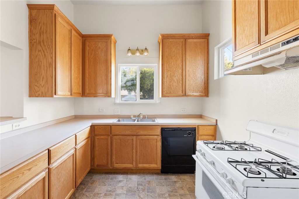 340 Oak Street Chico, CA 95928 - Photo 8 of 14 a kitchen with a stove sink and cabinets