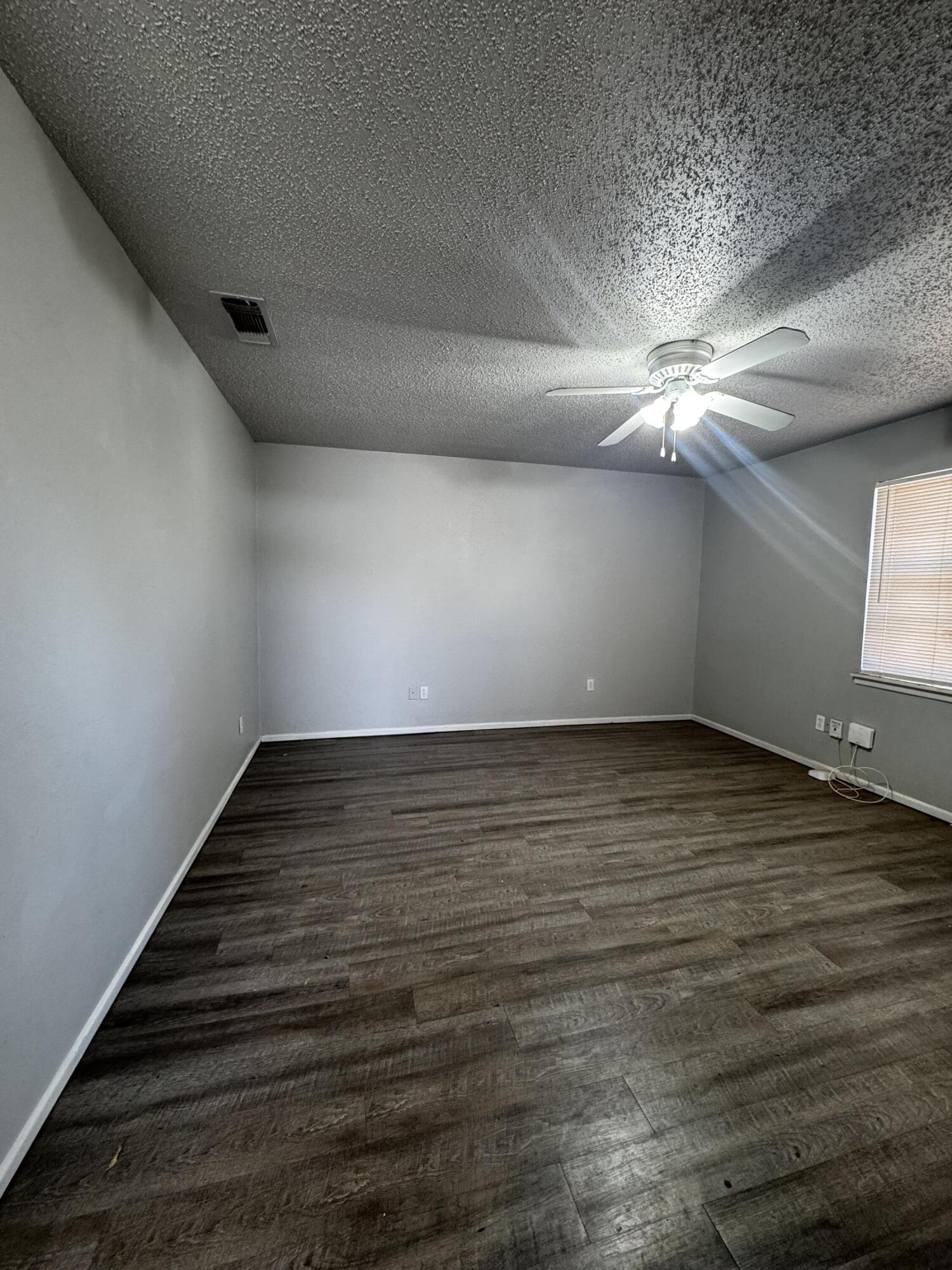 6113 37th Street, Unit B Lubbock, TX 79407 - Photo 3 of 10 a view of an empty room