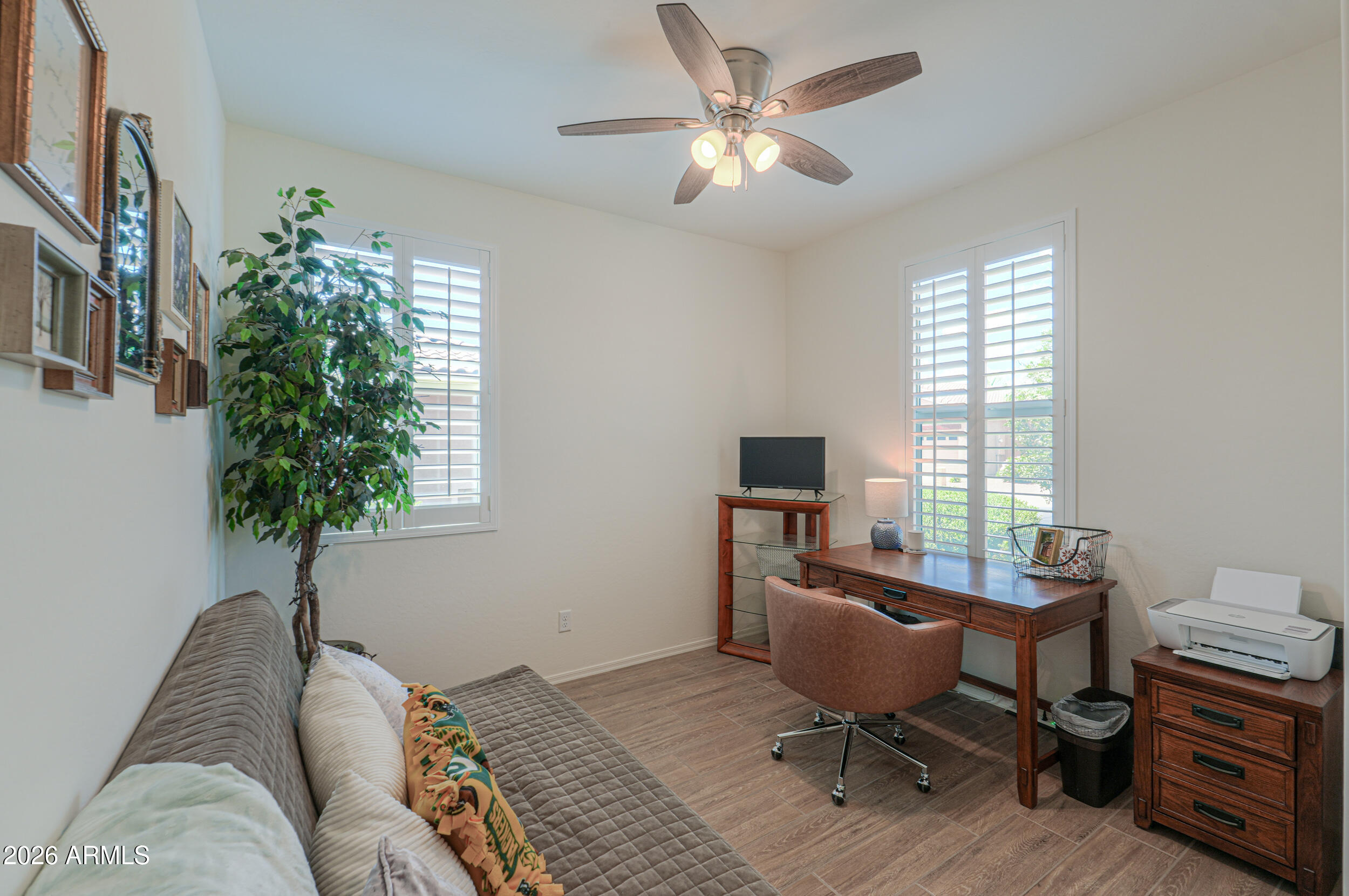 42085 West Cribbage Road Maricopa, AZ 85138 - Photo 5 of 35 a view of a livingroom with workspace and a window