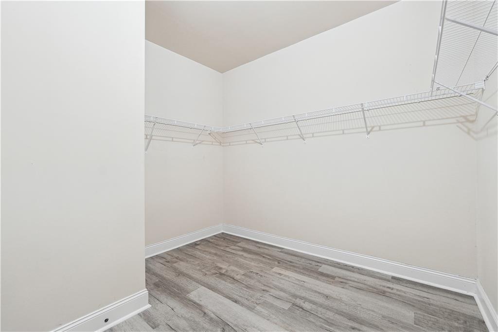 5145 Rialto Way Cumming, GA 30040 - Photo 14 of 25 a view of a room with racks on the wall