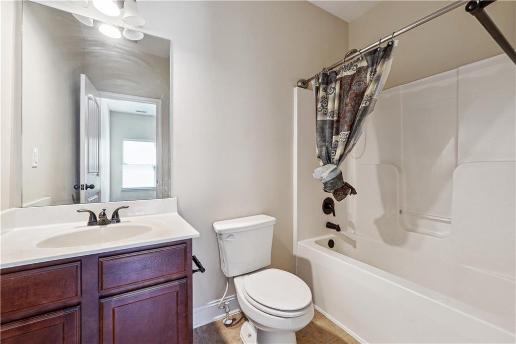 5145 Rialto Way Cumming, GA 30040 - Photo 20 of 25 a bathroom with a sink a toilet and shower