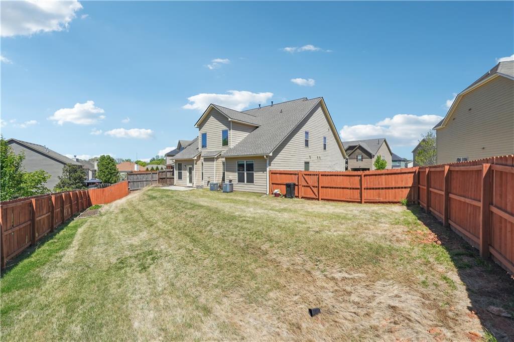 5145 Rialto Way Cumming, GA 30040 - Photo 25 of 25 a house with trees in front of it