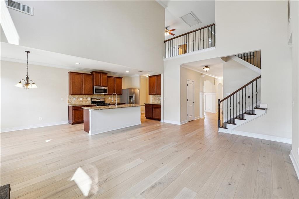 5145 Rialto Way Cumming, GA 30040 - Photo 5 of 25 a view of kitchen with microwave and cabinets