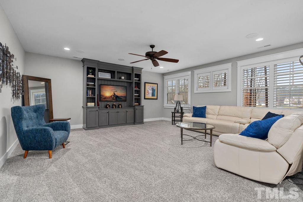 6901 Bartons Bend Way Raleigh, NC 27614 - Photo 22 of 30 a living room with furniture and a flat screen tv