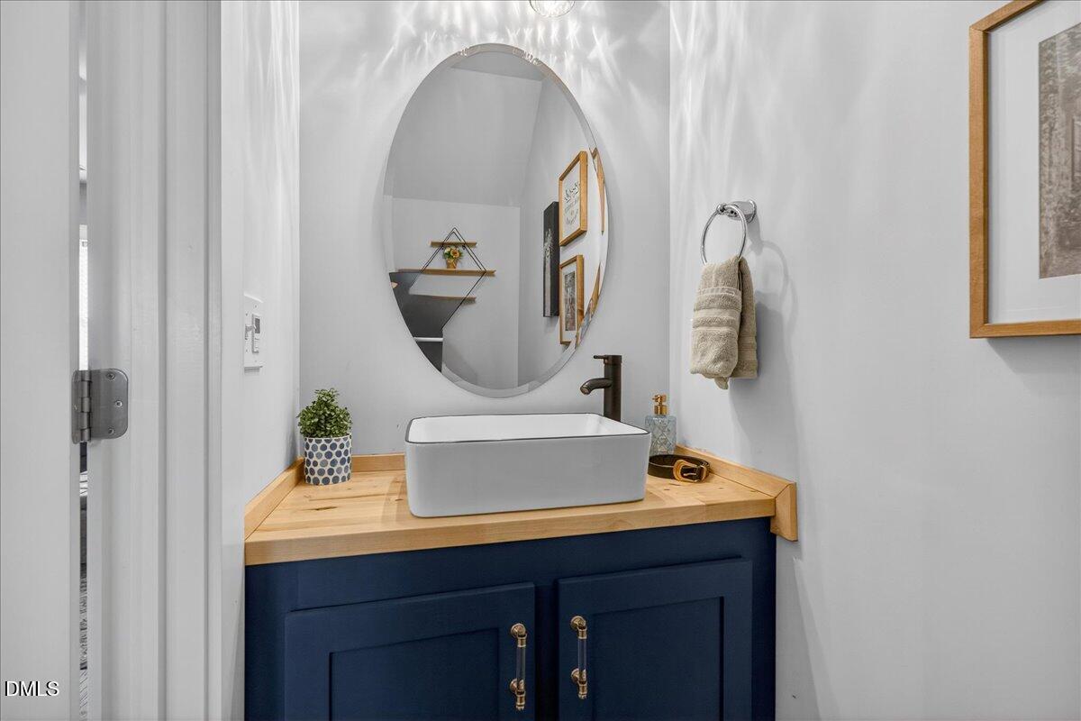 251 Daniel Ridge Road Wendell, NC 27591 - Photo 20 of 73 a bathroom with a sink and a mirror