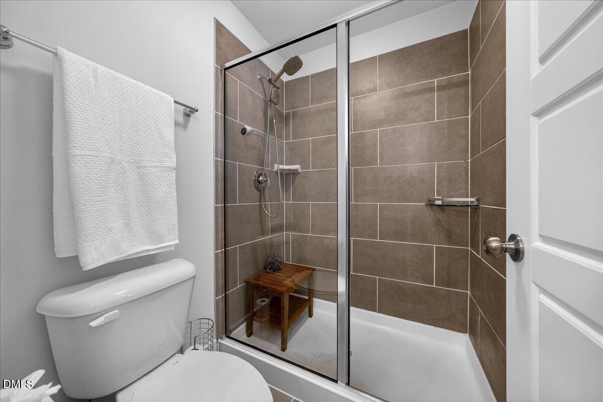 251 Daniel Ridge Road Wendell, NC 27591 - Photo 25 of 73 a bathroom with a toilet and a shower