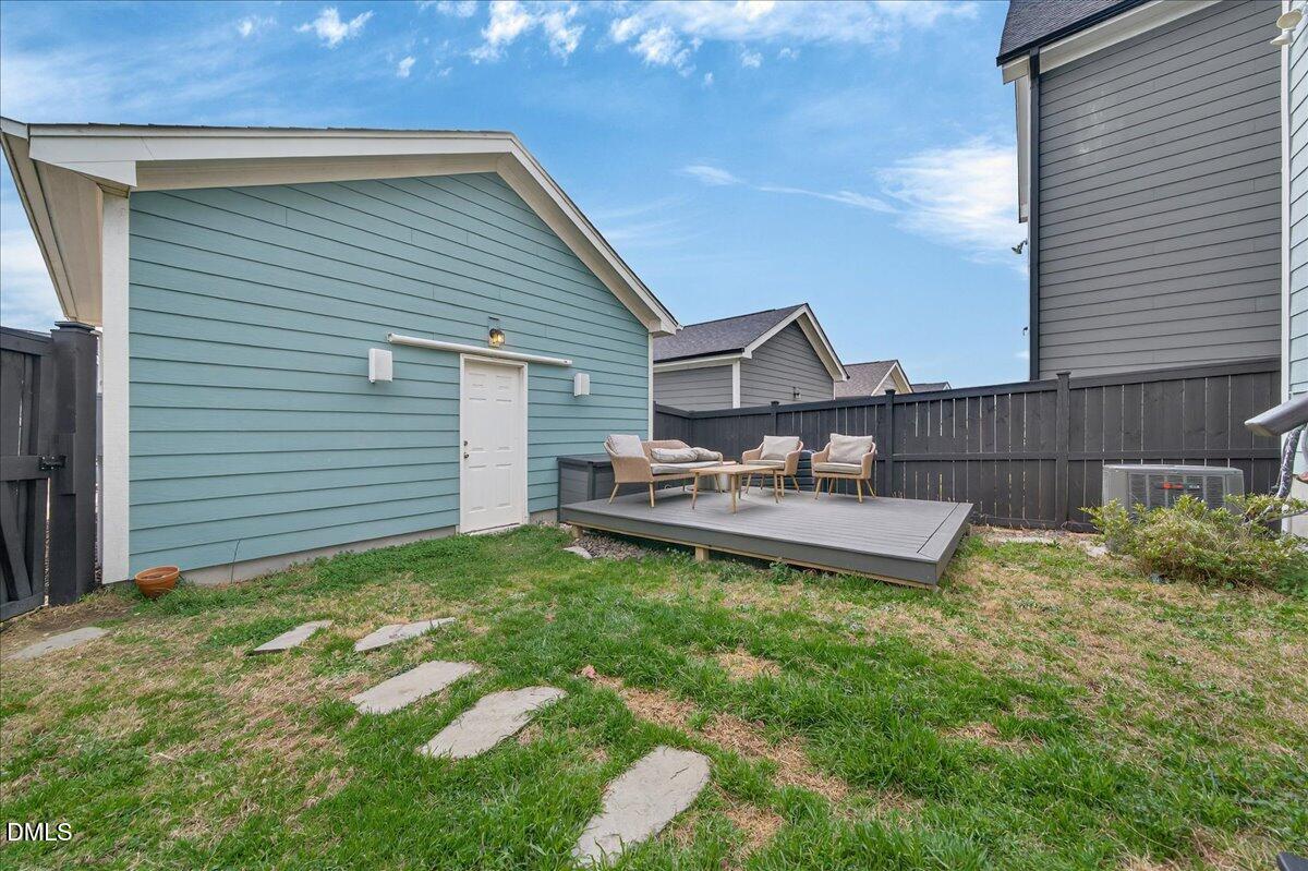 251 Daniel Ridge Road Wendell, NC 27591 - Photo 38 of 73 a view of a backyard with sitting area