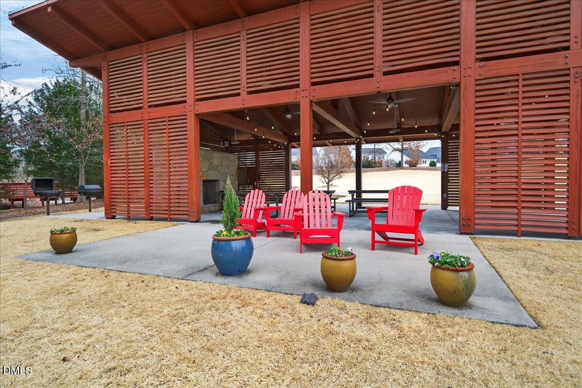 251 Daniel Ridge Road Wendell, NC 27591 - Photo 53 of 73 a view of a chairs and tables in patio of the house