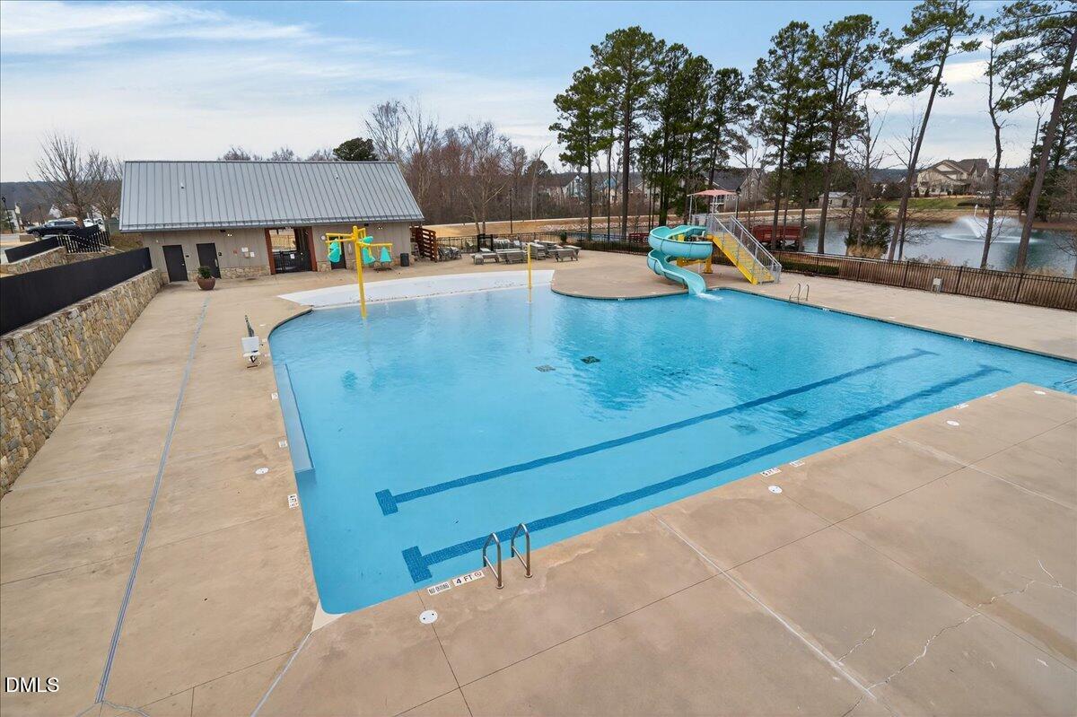 251 Daniel Ridge Road Wendell, NC 27591 - Photo 62 of 73 a view of a swimming pool with a lounge chair