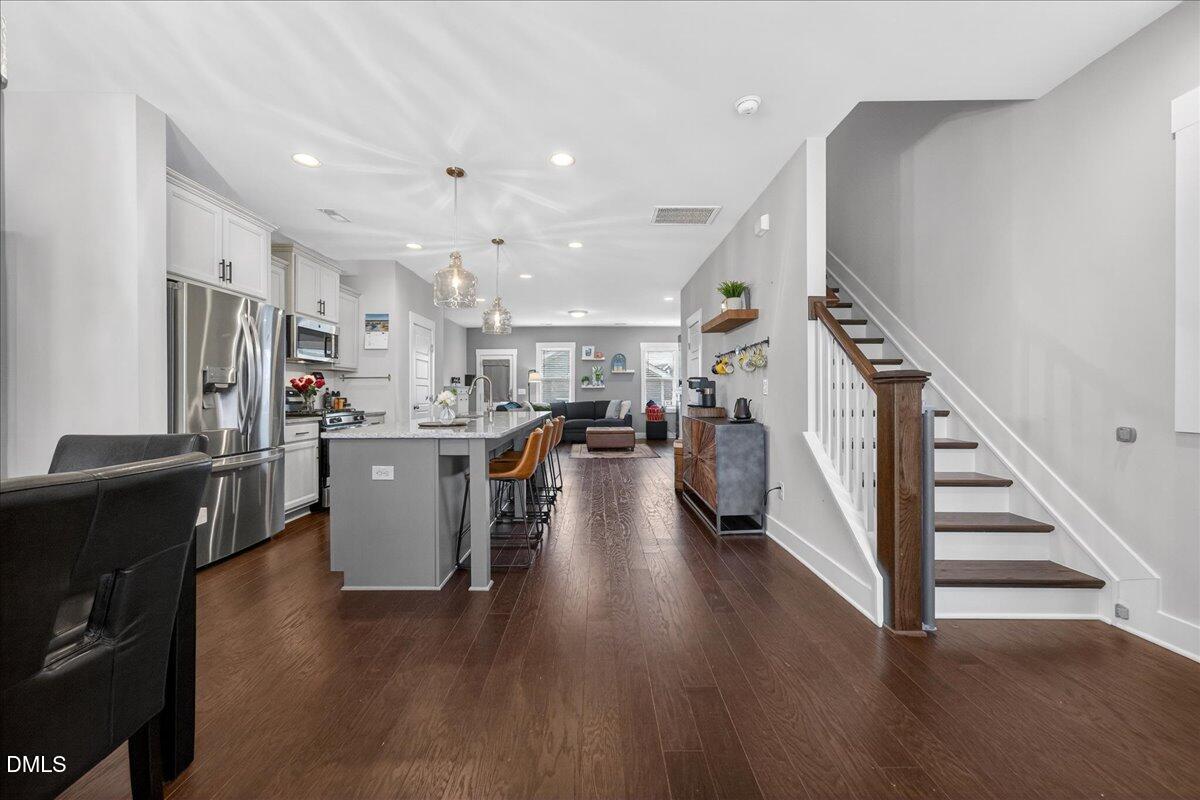 251 Daniel Ridge Road Wendell, NC 27591 - Photo 6 of 73 a view of a kitchen with furniture and wooden floor
