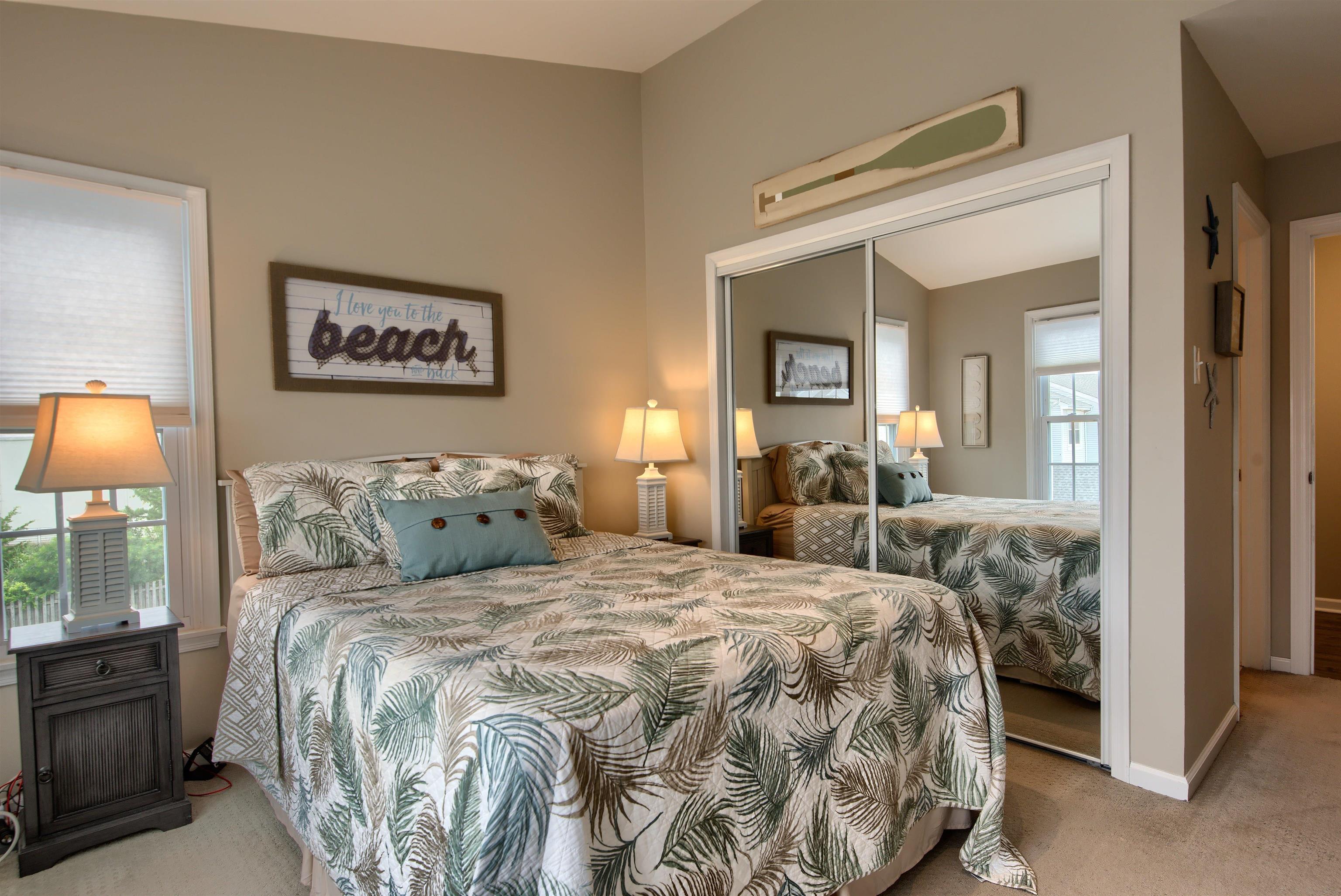167 South 40th, Unit 2 Brigantine, NJ 08203 - Photo 14 of 28 a bedroom with a bed and a lamp