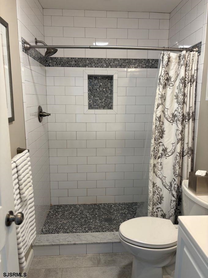 167 South 40th, Unit 2 Brigantine, NJ 08203 - Photo 17 of 28 a bathroom with a toilet and a shower