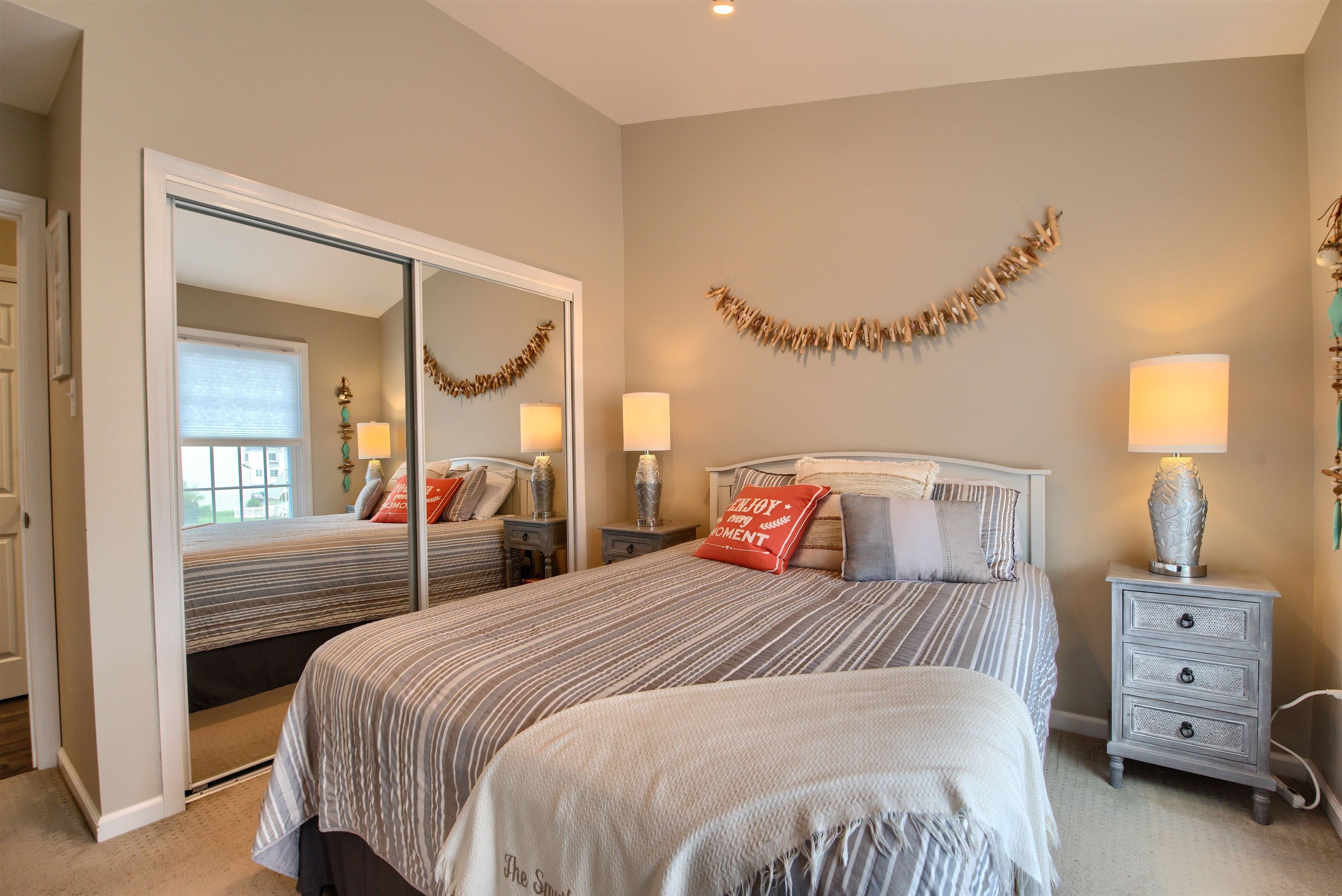 167 South 40th, Unit 2 Brigantine, NJ 08203 - Photo 19 of 28 a bedroom with a bed and a mirror